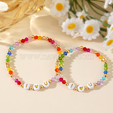 Heart-shaped crystal bracelet set with white background and gold letter I.