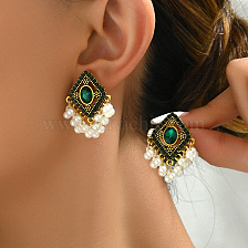 Vintage Ethnic Style Zinc Alloy Earrings with Hollow Tassels for Women.