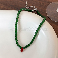 Vintage green bead necklace with red droplets for a bright look.