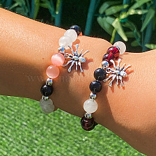 Glass bead bracelet with spider pendant, perfect for daily wear and gifting.